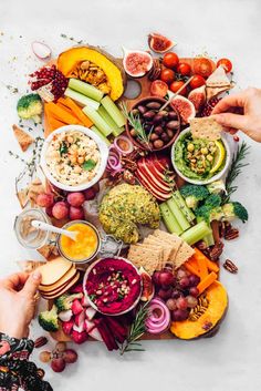 an assortment of fruits and vegetables are arranged on a white surface with text overlay