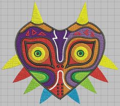 a heart shaped mask with horns and spikes on it's face, in the shape of a sun