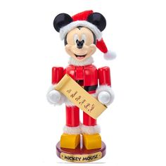 a mickey mouse figurine holding a sign