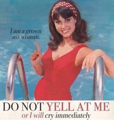 a woman in a red swimsuit pointing at the camera with an ad for women's magazine