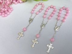 45 beautiful small rosaries for baptism favors they are pearlized pink color beads in the shape of a cute rose bud, accented in gold or silver tone . beads are 6mm imported, acrylic in the shape of a rose bud all hand made with image of our lady of guadalupe in center piece. measure 4.5' inches long. small cross has a cute litle heart in the midle. hablamos espanol, si tiene preguntas con gusto le ayudamos Silver Beaded Rosary For First Communion, Silver Rosary Bracelet With Round Beads For Baptism, Personalized Silver Rosary For Confirmation, Silver Baptism Jewelry With 8mm Beads, Silver Rosary Bracelet With Round Beads For First Communion, Silver Spiritual Rosary Bracelet For First Communion, Silver Jewelry With 8mm Beads For Baptism, Silver Spiritual Jewelry For Baptism, Silver Rosary For Baptism