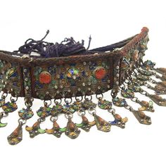 Kabyle Fine Enamel Diadem Crown Size approx. 21" The Kabyle of Algeria are one of the groups of indigenous peoples of North Africa generally known as Berber. Jewelry with cloisonné enameling is one of their highly developed cultural expressions. Pieces are usually made of silver decorated with green, yellow and blue enamels and set with coral, colored glass and beads. Pendants, rings, bracelets, anklets, earrings and headdresses serve as a way of accumulating family wealth and often make up the Traditional Multicolor Necklace With Inlay, Traditional Inlay Necklaces For Collectors, Traditional Silver Embroidered Jewelry, Traditional Multicolor Collectible Necklaces, Family Wealth, Berber Jewelry, Rings Bracelets, Enamels, Yellow And Blue