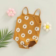 Your baby girl will blossom in our DAISY Ribbed Onesie! Available in three darling colors, this playful onesie is a must-have for any wardrobe. The ribbed fabric provides both comfort and style, adding a touch of sunshine to your little one's look! Cute Spring Cotton Bodysuit, Spring Cotton Bodysuit For Playtime, Spring Playtime Cotton Bodysuit, Spring Sleeveless Bodysuit, Sleeveless Spring Bodysuit, Cute Spring Bodysuit For Playwear, Cute Bodysuit For Spring Playtime, Cute Bodysuit For Playtime In Spring, Spring Cotton Ribbed Bodysuit