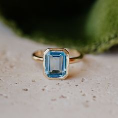 Emerald Cut Swiss Blue Topaz Solitaire Ring Bezel Setting, Statement Ring, December Birthstone Ring  14K Yellow Gold Engagement Ring Ring Description: Maine Stone - Topaz Stone Creation - Lab Created  Stone Shape - Emerald Stone Color - Blue Stone Size -8x6 mm Features: * Handmade * Ready To Ship * Brand New * All Ring Sizes Available * Suitable For Every Day * 14k Solid Gold / 18k Solid Gold / Gold Filled Over Sterling Silver * Purity Stamped * Fits True to Size * High Quality * Available Color Engagement Ring Bezel, Topas Ring, December Birthstone Ring, Yellow Gold Engagement Ring, Ring Bezel, Emerald Cut Rings, London Blue Topaz Ring, Chevron Ring, Deco Wedding