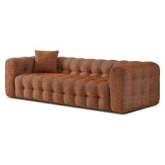 a brown couch sitting on top of a white floor