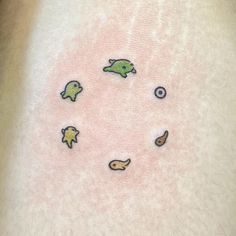 a close up of a person's stomach with fish and stars on the side