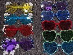 Super cute heart shaped colored sunglasses with sparkling rhinestone trims or pearls. If interested in custom color designs please message :) Bedazzled Heart Sunglasses, Birthday Sunglasses, Diy Sunglasses, Guard Gifts, Craft Summer, Swift Party, Bead Accessories, Dream Birthday, Beaded Sunglasses