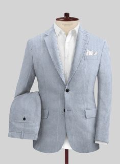 The Solbiati Light Blue Seersucker suit will be a treat for one's eye with an alluring visual that has the ability to exert influence over another. Crafted from pure cotton, the suit uses lightweight fabric with a crimped or puckered surface that features blue stripes inspired by a highly popular fashion genre. Get ready to look dapper with seersucker this season. 
 
 Seersucker's name comes from the Persian word: "SHUR E SHAKAR" which means sugar and milk, signifying the alternation of smooth a Summer Cotton Business Suits, Summer Cotton Suits With Welt Pockets, Tailored Striped Linen Blazer, Pinstripe Linen Blazer With Notch Lapel, Summer Cotton Suits With Long Sleeves, Pinstripe Cotton Blazer For Workwear, Pinstripe Cotton Blazer For Work, Summer Cotton Suit For Business Casual, Casual Tailored White Suits