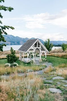 a gazebo in the middle of a grassy field