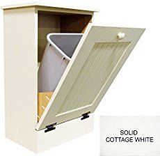 an open cabinet with the lid closed and some trash cans in it, next to a sign that says sold cottage white