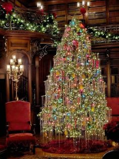 a christmas tree is lit up in the library