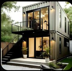 a house made out of shipping containers with stairs leading up to the second floor and windows