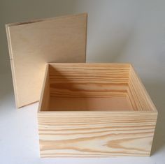 two wooden boxes sitting next to each other