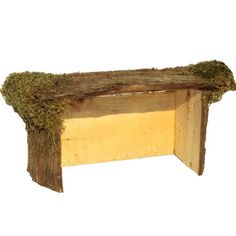 a wooden bench with moss growing on it's sides and the seat is made out of wood