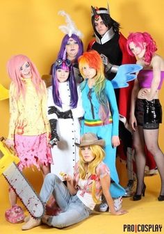 a group of people dressed in costumes posing for a photo