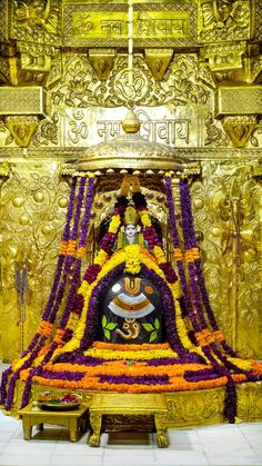 the shrine is decorated with flowers and decorations