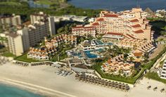 an aerial view of the resort and beach