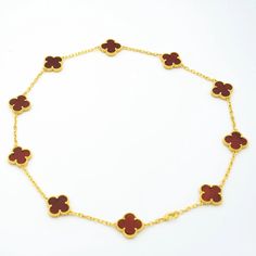 Add playful charm to any outfit with our VINTAGE CARNELIAN NECKLACE. Hand-crafted with 10 intricately designed motifs in gold, this necklace exudes a touch of quirky elegance. Perfect for the non-conformists and fashion-forward individuals, its golden hues and vintage appeal are sure to make a statement. Shine on, bold ones! ADDITIONAL INFORMATION Color: Gold Stone: Carnelian Ref. vcard40600 Material:- 925 Sterling Silver - 18k Gold Plated- 18k Real Gold ( contact us via instagram) Length of cha Luxury Gold-plated Charm Necklace, Luxury Gold Chain Necklace With Charms, Luxury 14k Gold Red Necklace, Luxury Red 14k Gold Necklace, Luxury Gold Charm Necklace, Elegant Red Necklace With Charms, Luxury Yellow Gold Plated Charm Necklaces, Luxury 14k Gold Necklaces With Charms, Luxury Yellow Gold-plated Charm Necklaces