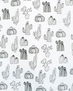 a white t - shirt with cactus designs on it