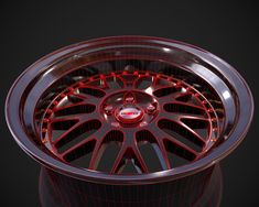 a wheel with red spokes is shown on a black background, and it appears to be made out of metal