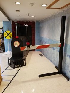 there is a black and white train on display in the room