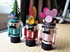 three nutcrackers are sitting on a table