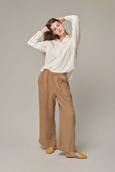 Effortlessly chic, these pants feature a flattering wide leg and mid-rise fit. Crafted from 100% hemp with a finely woven texture, they offer a luxurious linen feel and graceful drape. A versatile wardrobe essential, they elevate any ensemble, from swimsuits to blazers. Hemp Clothing, Hemp Fabric, Elegant Drapes, Woven Texture, Looks Chic, Luxury Linen, Pull On Pants, Sweater And Shorts, Swimwear Tops