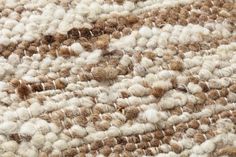 a close up view of an area rug that has been made with wool and yarn