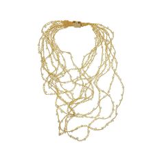 This hand-crocheted layered necklace were fabricated by skilled Brazilian artisans. They are shiny wire crochet earrings and they create a statement look without weight or bulk! Necklace secures through magnetic clasp Length approx. 28″ inches Hand Crocheted 18 Karat Gold Filled Made in Brazil Velvet Bag Included One Year Warranty They are very comfortable to wear, light and can be worn in every occasion: day-to-night and casual-to-special. The sparkling beads and colors are supplemental to the Elegant Multi-strand Chain Necklace With Gold Beads, Bohemian Handmade Gold Bridal Necklace, Gold Multi-strand Wire Wrapped Jewelry, Gold Wire Wrapped Multi-strand Jewelry, Gold Beaded Multi-strand Necklace, Gold Multi-strand Beaded Necklace, Delicate Gold Wire Wrapped Necklaces, Gold Handwoven Necklace For Gift, Delicate Gold Wire Wrapped Necklace