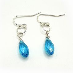 Elegant dangle earrings, a stunning combination of blue glass and silver French style ear wire. These exquisite earrings measure approximately 1 inch in length. The blue glass is 5mm in width. The wire is silver-plated. Add a touch of sophistication to any outfit with these captivating earrings. Please note that it is recommended to review all information provided before making your purchase. Care Instructions: ★Do not wear jewelry while swimming or bathing/showering. ★Keep jewelry in a dry loca Blue Sterling Silver Teardrop Earrings, Blue Sterling Silver Earrings With French Hook, Sterling Silver Blue French Hook Earrings, Blue Wire Wrapped Drop Earrings, Blue Dangle Earrings With French Hook, Blue Wire Wrapped Teardrop Earrings Gift, Blue Wire Wrapped Dangle Crystal Earrings, Blue Teardrop Wire Wrapped Crystal Earrings, Blue Crystal Earrings With Lever Back For Gift