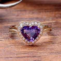 "(Please confirm your US size when you make an order) Jewelry Details -Gold Type : 14k gold Center Stone: NATURAL Amethyst 7mm, Approximately 1.5ct Color: 3A Clarity: VS Cut: Heart Cut / 3EX Side Stone: 0.14cttw diamond Color: G-H Clarity: SI1 Cut: Round Cut / 3EX Band Width: Approximately 2.1mm SKU: YR0072 ~*-*~Purchase Guarantee: - All our jewelry is handmade, and each process is refined. - 14 Day Refund Guarantee. - All our products are Free Shipping. - Free Gift Box&Packing. ~*-*~Please Amethyst Anniversary Ring With Halo Setting In Yellow Gold, 14k Gold Brilliant Cut Purple Amethyst Ring, Fine Jewelry Amethyst Ring Heart Cut, Purple Gemstone Heart Ring Fine Jewelry, Fine Jewelry Heart Cut Amethyst Ring, Heart-shaped Amethyst Ring With Accent Stones, Heart Shaped Amethyst Jewelry For Wedding, Heart-shaped Amethyst Ring For Anniversary, Heart-shaped Amethyst Wedding Jewelry