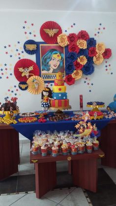 a table topped with lots of cupcakes and cake