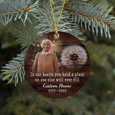 a wooden ornament with an image of a woman and a dandelion