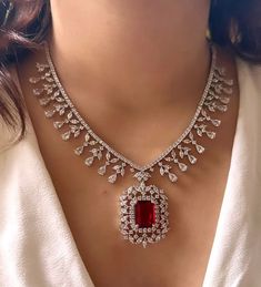 Add a touch of glamour and sophistication with this high quality red ruby pendant necklace set in beautiful zirconia stones. The stones in this set bling and look close to the real thing. This set is sure to make heads turn!  It features an adjustable necklace and a pair of earrings. It can be paired perfectly with both ethnic and western outfits.  Gorgeous fine quality Emerald CZ lab diamonds studded pendant set  in White gold plating and matching Earrings  *Comes with Statement matching earrin Diamond Sets Necklace Jewellery, Luxury Rose Cut Diamond Jewelry Sets For Wedding, Luxury Oxidized Jewelry For Engagement, Luxury Traditional Necklaces For Marriage, Luxury Traditional Necklace For Marriage, Luxury Multi-stone Necklace For Wedding, Luxury Fusion Style Ruby Necklace, Luxury Engagement Necklaces For Valentine's Day, Luxury Pink Bollywood Necklace