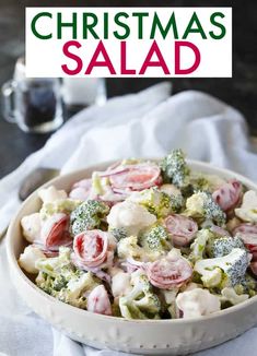 a bowl filled with broccoli and cauliflower on top of a table