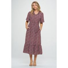 Our Bethany dress is a perfect blend of comfort and style for any occasion. This flowy dress features a flattering smocked waist and wide half sleeve. This dress complements all body types. Whether you're going out for brunch with friends or attending a garden party, this dress is sure to make you stand out. Material: 100% Polyester. Machine washable Bohemian V-neck Midi Dress With Smocked Bodice, Casual V-neck Smocked Dress With Floral Print, Casual V-neck Smock Midi Dress, Bohemian Midi-length Tiered Dress With Floral Print, Spring Floral Print V-neck Smocked Dress, Work Polo Shirts, Bubble Dress, Tiered Midi Dress, Long Shirt Dress