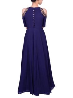 This navy blue georgette floor length with cold shoulder and a button up back is accessorized with zardozi cutwork on the cold shoulder.Care:Dry Clean Only and to be Steam PressedComposition:Georgette Blue Floor-length Georgette Blouse Piece, Chic Blue Cold Shoulder Dress, Blue Floor-length Georgette Dress, Blue Semi-stitched Floor-length Saree, Semi-stitched Blue Embroidered Sharara, Reception Gown, Floor Length Dress, Floor Length Dresses, Best Deal