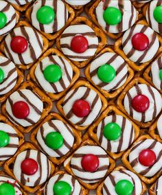 there are many pretzels with candy on the top one is white and green