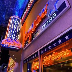 neon signs on the side of a building