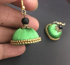 These are purely handmade dangling chandelier style earrings in silk thread wrapped jumka .a green silk thread with pink gold  earrings  These are an authentic Indian traditional earrings that could be worn by both traditional and an western attire. Note: The product shipped will be same as shown in the picture however, actual colours may vary slightly from those shown due to lighting in the photography. Pls note The shades of gold / silver  may vary slightly. We do not accept any returns or refunds.However in case of any issue we will definitely try and resolve it! Handmade Green Bohemian Jhumkas, Green Bohemian Dangle Jhumkas, Green Latkans Danglers For Celebration, Green Danglers With Latkans For Celebration, Festive Green Danglers With Latkans, Green Drop Earrings Jhumkas For Festivals, Green Latkans Earrings For Diwali, Handmade Green Festive Jhumkas, Green Drop Jhumkas For Festivals