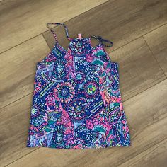 Lilly Pulitzer Multicolor Silky Tank Top. New Without Tags. Casual Purple Tank Top With Floral Print, Summer Printed Purple Tops, Purple Printed Summer Top, Summer Purple Printed Tops, Purple Stretch Summer Tops, Purple Printed Beach Tops, Stretch Purple Summer Tops, Purple Tank Top For Vacation, Stretchy Purple Summer Top