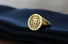 "lion head signet ring in gold and silver ♡ the ring has solid back. deep and detailed engraving very delicately handcrafted unisex - looks super cool on both women & men side or inside engravings cost 12 USD for both sides. please contact us if you request side engravins or simply go back to our shop and purchase the \"Side or inside engraving fee\" listing. face size 13x15 mm material options: 9k gold 14k gold 14k rose gold 14k white gold 925 sterling silver 14k gold plated rose gold plate Gold Signet Ring Mens, Mens Silver Signet Ring, Ring Mens Gold, Mens Signet Ring, Gold Lion