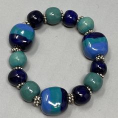 VTG Porcelain Bracelet Blue Green Teal Beads Painted Round Square Chunky 6.5" Bohemian Blue Stretch Bracelet With Large Beads, Blue Stretch Bracelet With Colorful Beads, Blue Stretch Bracelet With Polished Beads As Gift, Gift Blue Stretch Bracelet With Polished Beads, Casual Blue Bracelets With Large Beads, Blue Czech Glass Bracelets With Colorful Beads, Blue Stretch Bracelet With Large Round Beads, Blue Bracelets With Large Round Beads, Casual Blue Beaded Bracelet With Large Beads