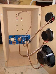 an electrical panel with wires and plugs attached to it