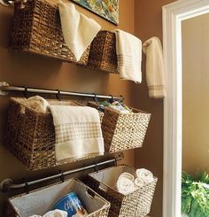 bathroom with baskets and towels hanging on the wall