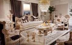 a fancy living room with white furniture and chandelier