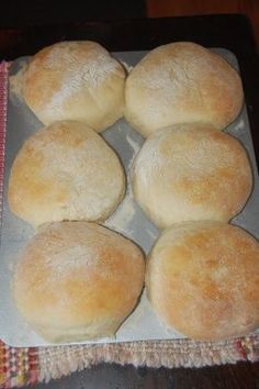 six rolls on a baking sheet ready to be baked in the oven for dinner or dessert