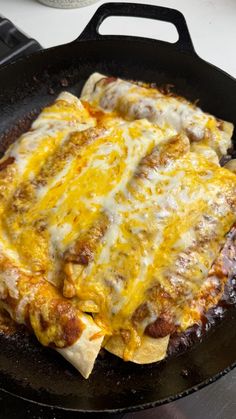 two quesadillas are being cooked in a skillet on top of the stove