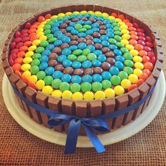 a cake decorated with chocolate and colorful candies