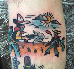 a man's foot with an old timey tattoo on it, and the image of two cowboys